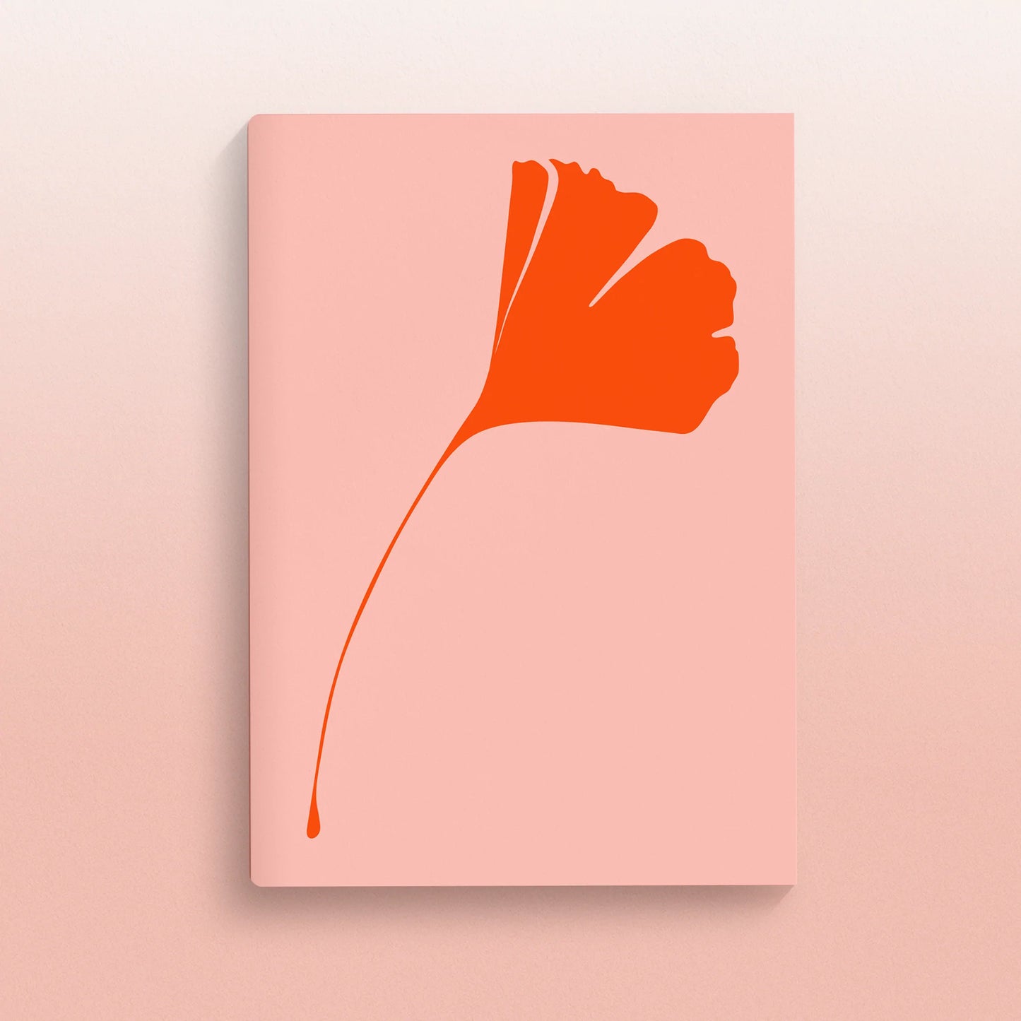 A5 notebook from the brand Common Modern. The cover has a pale pink background and a ginkgo leaf in orange.